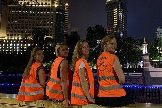The Best of Kuala Lumpur Sunset and Night tour - Helmets, Orange Vests, and Basket Bikes at a Leisurely Tempo